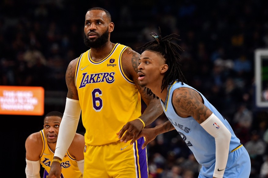 Memphis Grizzlies' Ja Morant guarding Los Angeles Lakers' LeBron James during a regular season game.