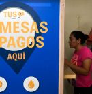 Woman withdraws remittance from U.S. in Guatemala