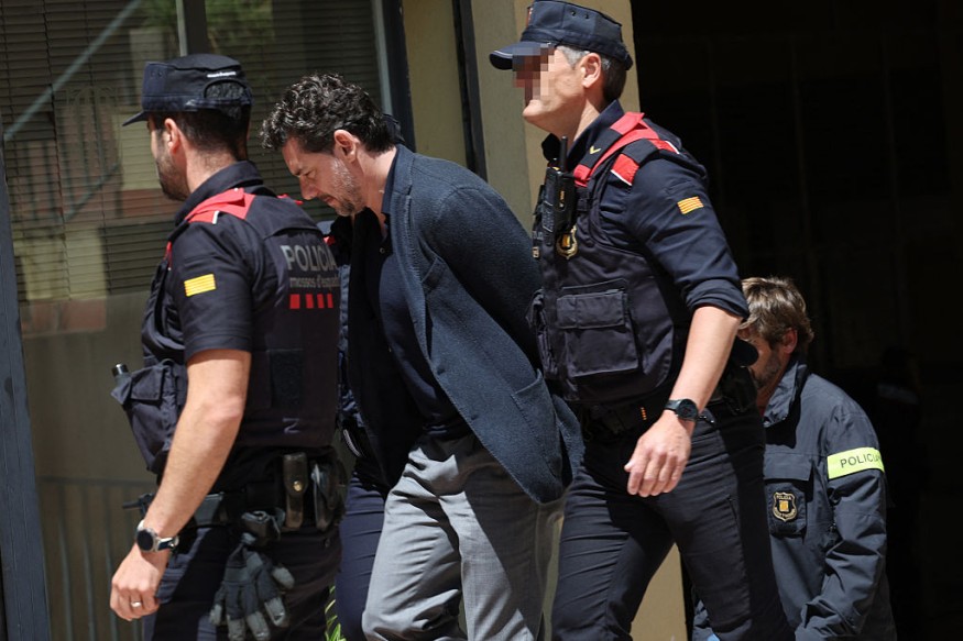 Jonathan Andic is escorted by Catalan regional police officers